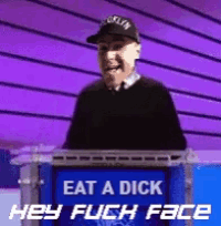 a man stands at a podium that says eat a dick