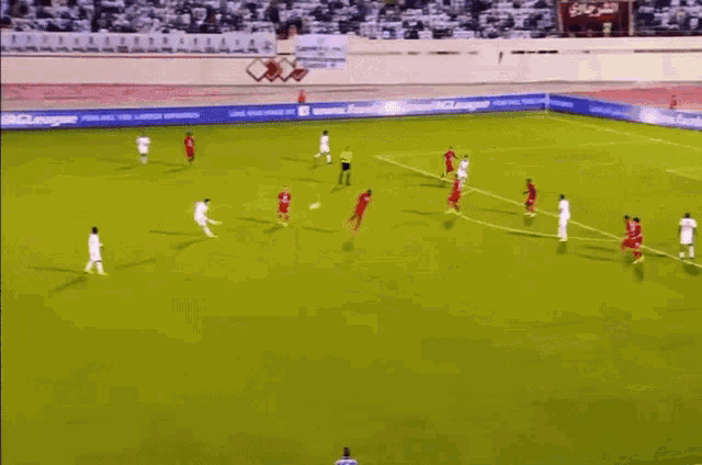 a soccer game is being played on a field with a banner that says ' allianz '