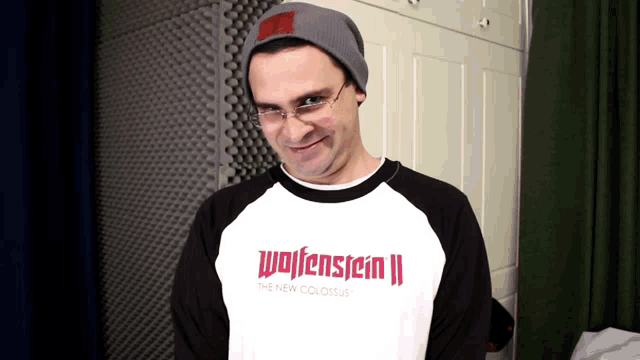 a man wearing a shirt that says wolfenstein ii