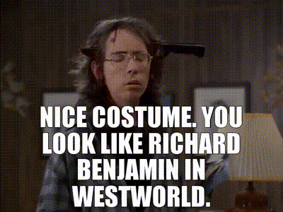 a man in a costume with a knife in his head says nice costume you look like richard benjamin in westworld .