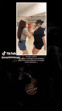 a screenshot of a tiktok video shows two women fighting each other