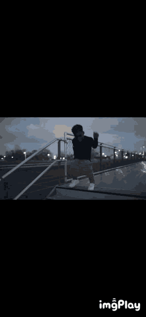 a person is walking up a set of stairs with the word imgplay on the bottom right