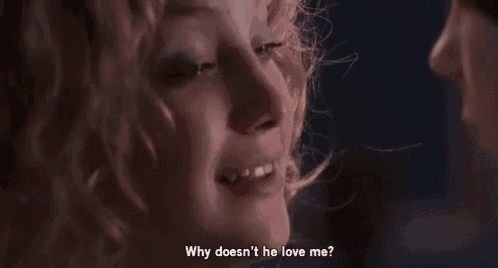 a close up of a woman 's face with the words why does n't he love me written below it