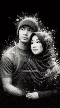 a man wearing a beanie and a woman wearing a hijab are posing for a photo