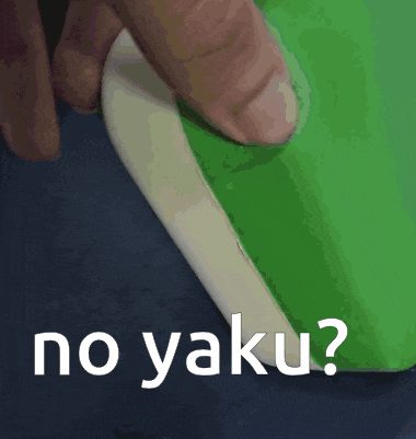a person is holding a piece of paper with the words no yaku on it