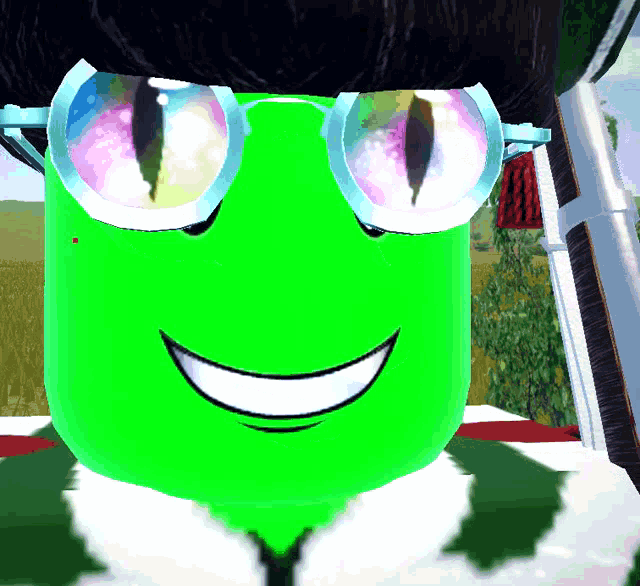 a green cartoon character with glasses and a big smile
