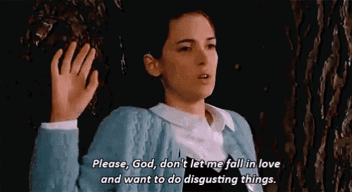 a woman in a blue cardigan is saying please god don 't let me fall in love and want to do disgusting things