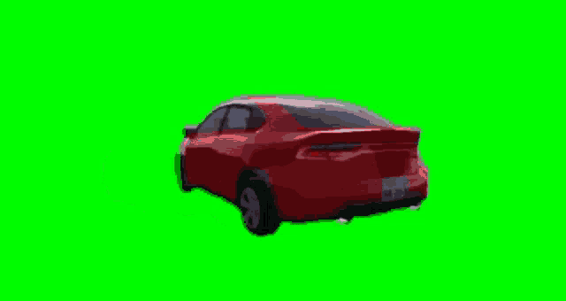 a red car is on a green screen .