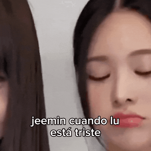a close up of a woman 's face with the words jeemin cuando lu esta triste written on it