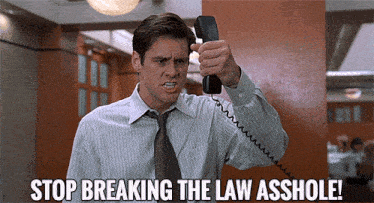 a man talking on a phone with the words stop breaking the law asshole on the bottom