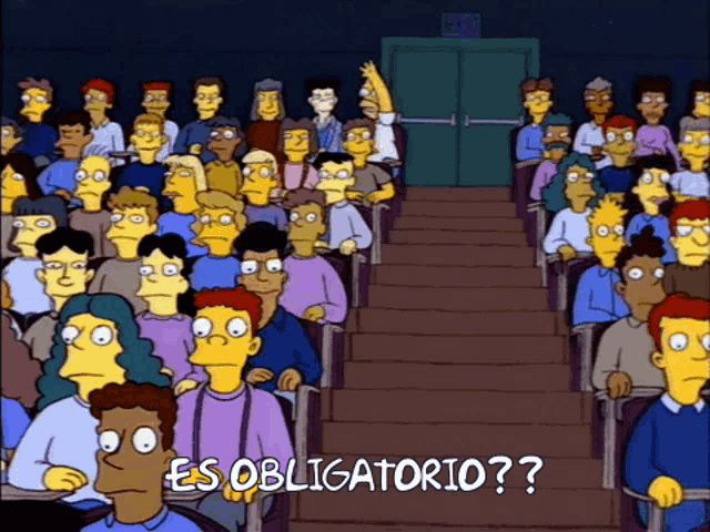 a crowd of people are sitting in an auditorium with the words " es obligatorio " on the bottom right