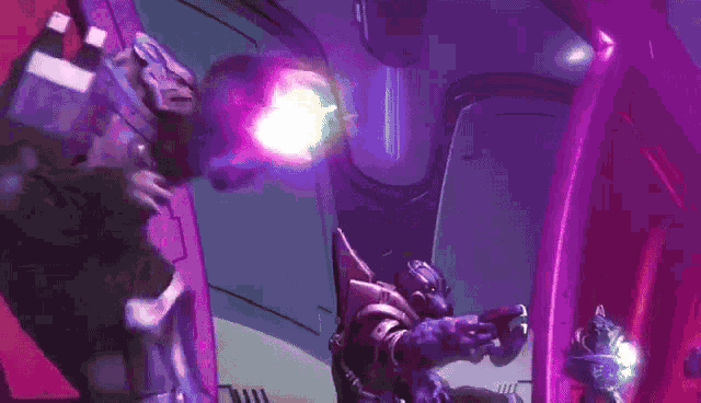 a purple light is being thrown at a person in a room .