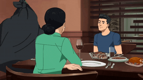 a man and a woman are sitting at a table with plates of food and a glass of wine
