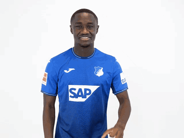 a man wearing a blue shirt with the word sap on the front