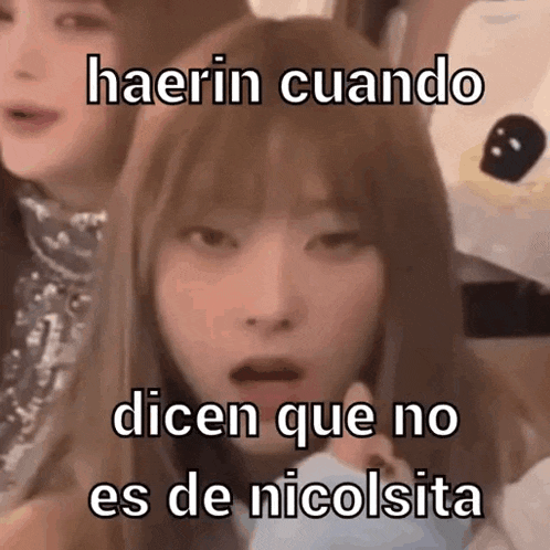 a girl with a surprised look on her face says haerin cuando dicen que no es de nicolsita .
