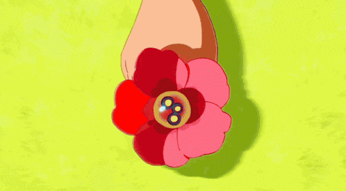 a close up of a person with a flower in their hair and a button on it