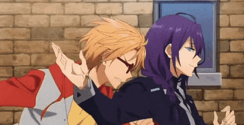 a couple of anime characters are standing next to each other and making funny faces .