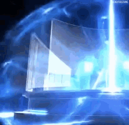 a blue light is coming out of a box in the dark .