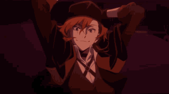 a man with red hair is wearing a hat and a vest