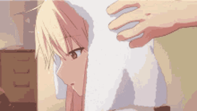 a person is putting a towel over a girl 's head .