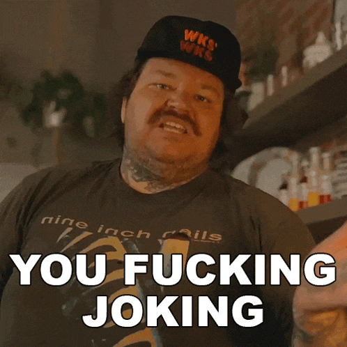 a man wearing a wks hat and a shirt that says you fucking joking