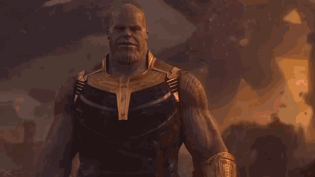 thanos is holding the infinity gauntlet with purple and red lights