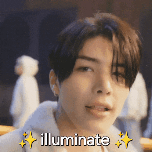 a close up of a man 's face with the words illuminate written above him