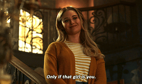 a woman says only if that girl is you while standing on a set of stairs
