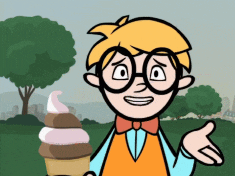 a boy with glasses is holding an ice cream cone and smiling