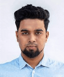 a young man with a beard is wearing a blue shirt .