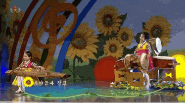 a girl playing a musical instrument in front of a sunflower background