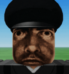 a close up of a man 's face with a black hat on