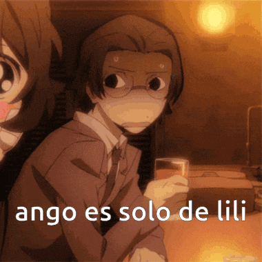 a man in a suit and tie is holding a glass with the words ango es solo de lili written on it