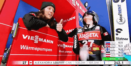a woman giving a thumbs up next to a man wearing a shirt that says argeta