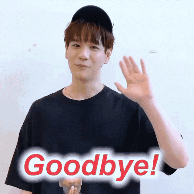 a man wearing a black hat and a black shirt says goodbye with his hand