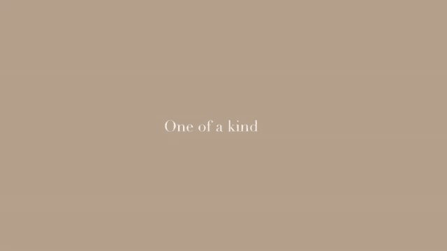 a beige background with the words `` one of a kind '' written on it