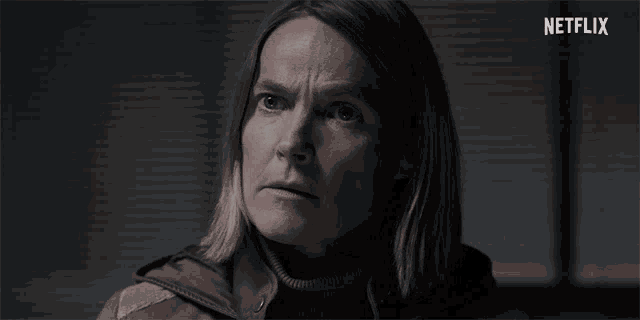 a close up of a woman 's face with netflix written in the corner