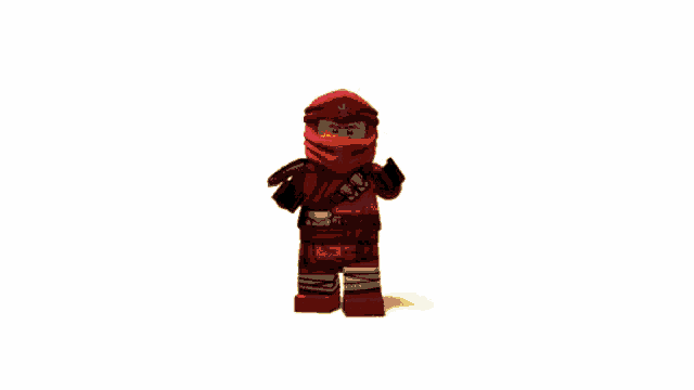 a red object is surrounded by flames and a white background