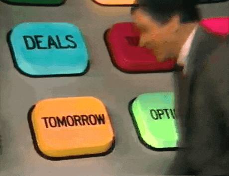 a man in a suit and tie is looking at buttons that say deals and tomorrow