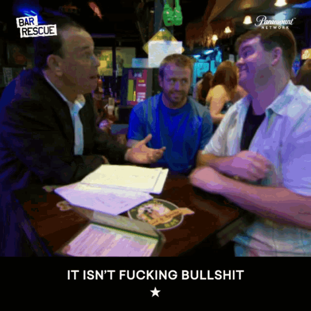 three men are sitting at a table in front of a sign that reads bar rescue
