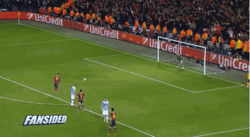 a soccer game is being played on a field with a banner for unicredit