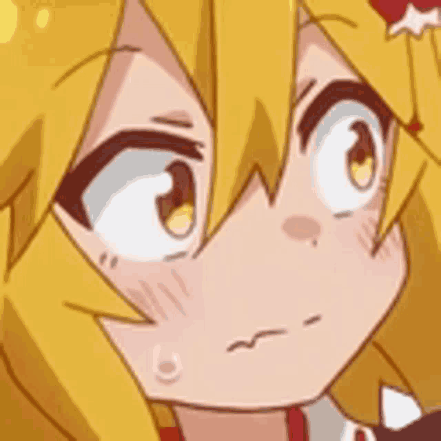 a close up of a cartoon character 's face with yellow hair and a red star in her hair .