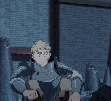 a man in armor standing in front of a brick wall