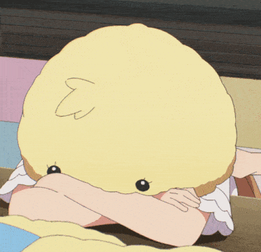 a girl wearing a yellow hat with a pink nose
