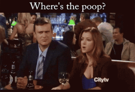 a man and a woman are sitting at a table with the words where 's the poop below them