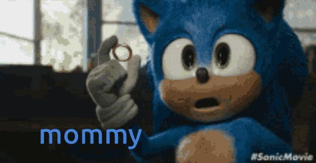 a sonic the hedgehog holding a ring in his hand