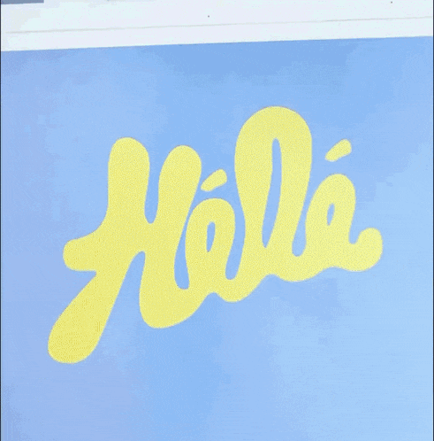 a sign that says hola on it in black