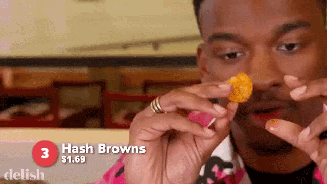 a man eating hash browns for $ 0.69