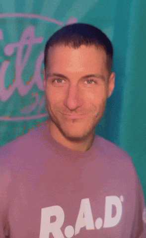 a man is wearing a purple shirt that says rad