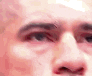 a close up of a man 's face with a white background